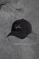 Black cap with 'Pypher' logo on a textured gray surface