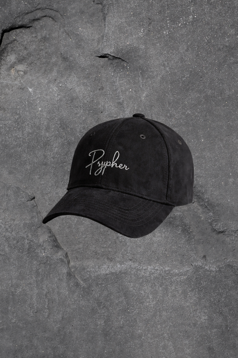 Black cap with 'Pypher' logo on a textured gray surface
