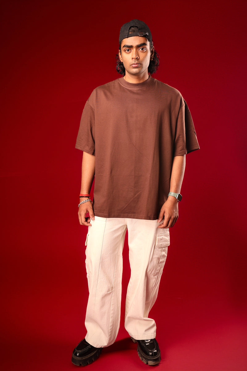 Model wearing brown solid oversized streetwear t-shirt by Psypher India
