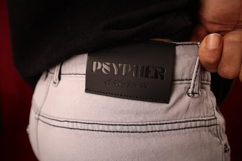 Close-up detail of grey straight-leg streetwear jeans India