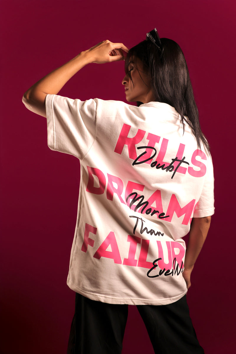 Model wearing white oversized motivational streetwear t-shirt with pink text by Psypher India