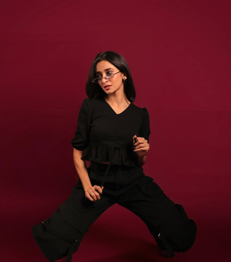 Model wearing black cropped streetwear top for women by Psypher India