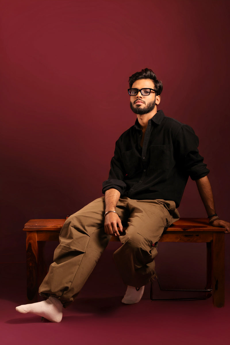 Model wearing black corduroy streetwear shirt for men by Psypher India