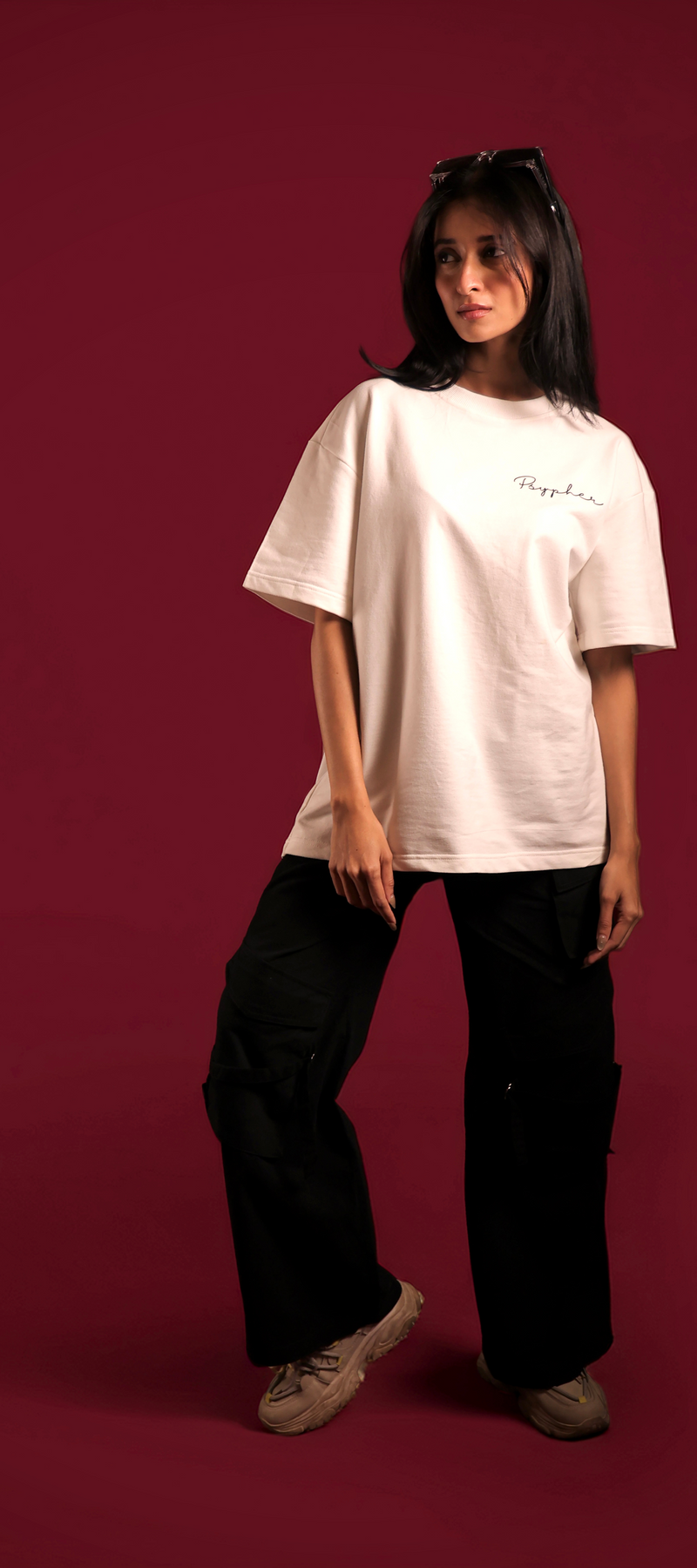 Front view of wearing white oversized motivational streetwear t-shirt with pink text by Psypher India